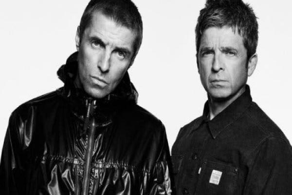 Liam and Noel Gallagher stand side by side.